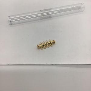 CLP fluted 4 Strand clasp gold