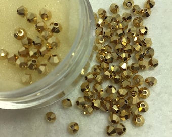 PREC 3mm Preciosa Bicone Crystal Aurum Full.  Sold per bag of 48 crystal beads