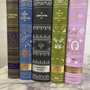 May include: Five hardcover books with gold lettering and decorative designs on the spines. The titles are "Wuthering Heights", "Pride and Prejudice", "Jane Eyre", "Sense and Sensibility", and "Emma".