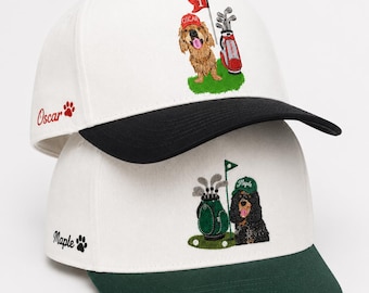 May include: Two white baseball caps with embroidered designs. The top cap has a black brim and features a golden dog wearing a red hat next to a golf bag and flag. The bottom cap has a green brim and a black dog wearing a green hat with a golf bag.