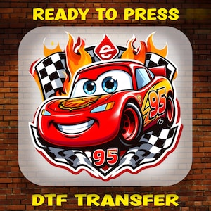 May include: A DTF transfer featuring a red cartoon race car with the number 95 on its side and hood, surrounded by orange flames and black and white checkered flags. The text READY TO PRESS and DTF TRANSFER appears in yellow letters.
