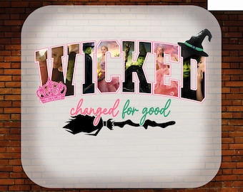 May include: A DTF transfer sheet featuring the word WICKED in large block letters filled with imagery of characters from the musical, including a pink crown, a green witch, and a pink gown. Below, the text changed for good sits above a black broom.