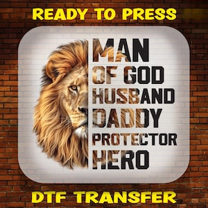 May include: A digital design featuring a lion's head with the text "Man of God, Husband, Daddy, Protector, Hero" in black letters on a white background. The design is labelled "Ready to Press" and "DTG Transfer".