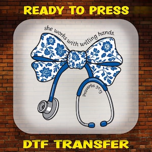 May include: A DTF transfer featuring a blue and white floral patterned bow attached to a stethoscope. The text reads "she works with willing hands" and "Proverbs 31:13". The design is set against a white background with "READY TO PRESS" at the top.