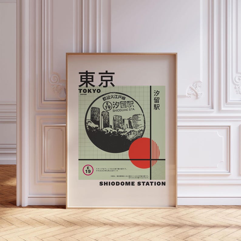 May include: A green and white poster with a black and white illustration of a city skyline. The poster has the text "Tokyo" and "Shiodome Station" in black. The poster also has a red circle with white stripes.