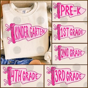 May include: A cream-colored crewneck sweatshirt featuring a pink pennant graphic with a gingham pattern and a bow. The text reads PRE-K, KINDERGARTEN, 1ST GRADE, 2ND GRADE, 3RD GRADE, and 4TH GRADE in a bold, bright pink font on separate pennants.