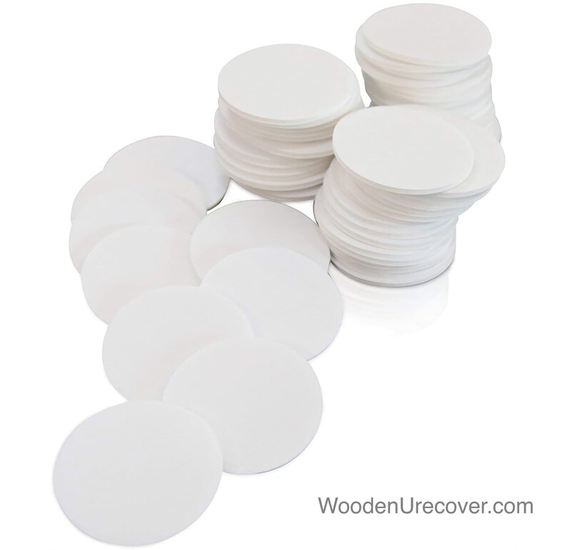 May include: A stack of white round paper filters, perfect for coffee brewing or other filtering needs.  There are two stacks of filters, one with 20 filters and the other with 30 filters.