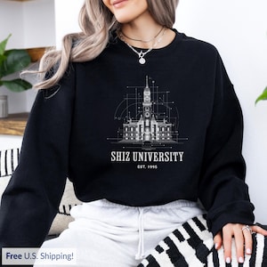 Shiz University sweatshirt, perfect for Wicked fans, magical apparel inspired by Elphaba and Glinda, great for women who love musicals.