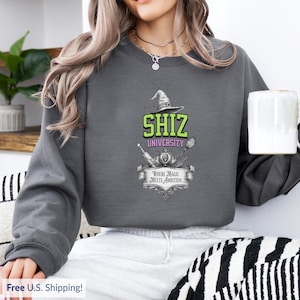 Shiz University sweatshirt, perfect for Wicked fans, magical apparel inspired by Elphaba and Glinda, great for women who love musicals.