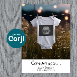 May include: A white baby onesie with a grayscale ultrasound image is hanging on a clothesline. The text "Coming soon..." is displayed below, along with "BABY WILSON DUE JANUARY 2026". The background features a blurred field of flowers and string lights.