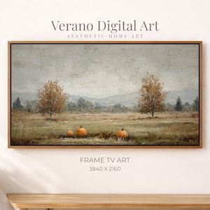 May include: A framed digital art print featuring a pastoral landscape with pumpkins in a field. The artwork has a muted color palette with a cloudy sky, trees, and rolling hills. The text "Verano Digital Art" and "Frame TV Art" are visible.