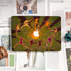 May include: A laptop skin featuring a stylized design with a white Apple logo at the center, surrounded by orange and purple figures in motion. The background has green and brown stripes.