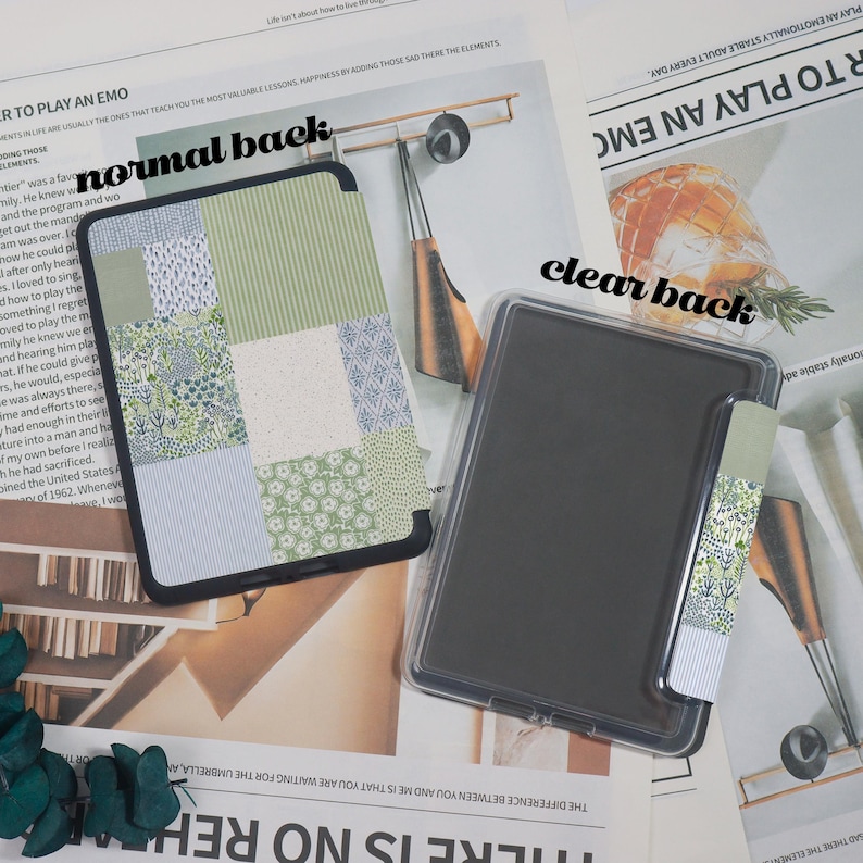 May include: Two tablet cases are displayed. One has a patchwork design in shades of green and white. The other is clear. Both cases have a black border. A matching patterned bookmark is attached to the clear case.