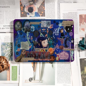May include: A rectangular mousepad featuring a collage of illustrations and text from the movie "Coraline." The design includes characters, buttons, and the phrase "Be careful what you wish for." The color palette is primarily blue and purple.