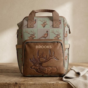 Mochila cambiador con estampado de retazos de alces y faisanes / Bolsillo frontal personalizado en relieve