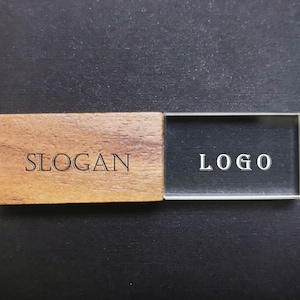 May include: A wooden USB drive with a clear plastic cover. The wooden part has the word "SLOGAN" engraved on it, and the plastic cover has the word "LOGO" engraved on it.
