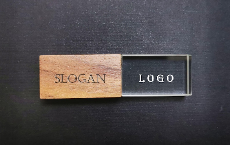 May include: A wooden USB drive with a clear plastic cover. The wooden part has the word "SLOGAN" engraved on it, and the plastic cover has the word "LOGO" engraved on it.