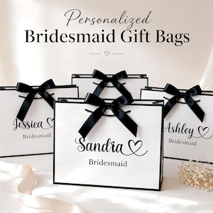 May include: White gift bags with black trim and black satin bows. The bags are personalized with names and the word "Bridesmaid". The text "Personalized Bridesmaid Gift Bags" is at the top of the image.