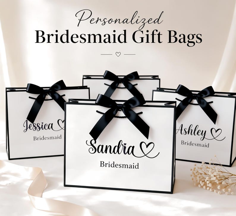 May include: White gift bags with black trim and black satin bows. The bags are personalized with names and the word "Bridesmaid". The text "Personalized Bridesmaid Gift Bags" is at the top of the image.
