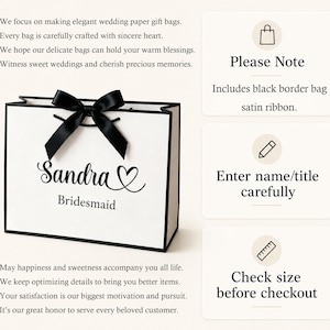 May include: A white paper gift bag with a black border and a black satin ribbon bow. The bag is personalized with the name "Sandra" and the word "Bridesmaid" in elegant script. The bag is designed for weddings.
