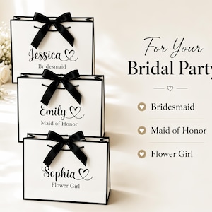 May include: White gift bags with black trim and bows, personalized with names and titles for a bridal party. The bags are labeled "Jessica, Bridesmaid", "Emily, Maid of Honor", and "Sophia, Flower Girl". Text on the right reads "For Your Bridal Party".