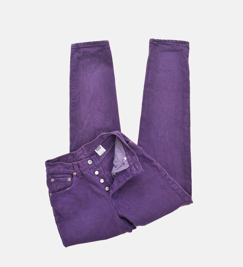 vintage 80s purple Levi's high waisted slim fit tapered leg jeans with button down fly.
