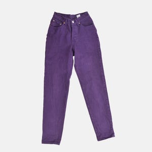 vintage 80s purple Levi's high waisted slim fit tapered leg jeans with button down fly.