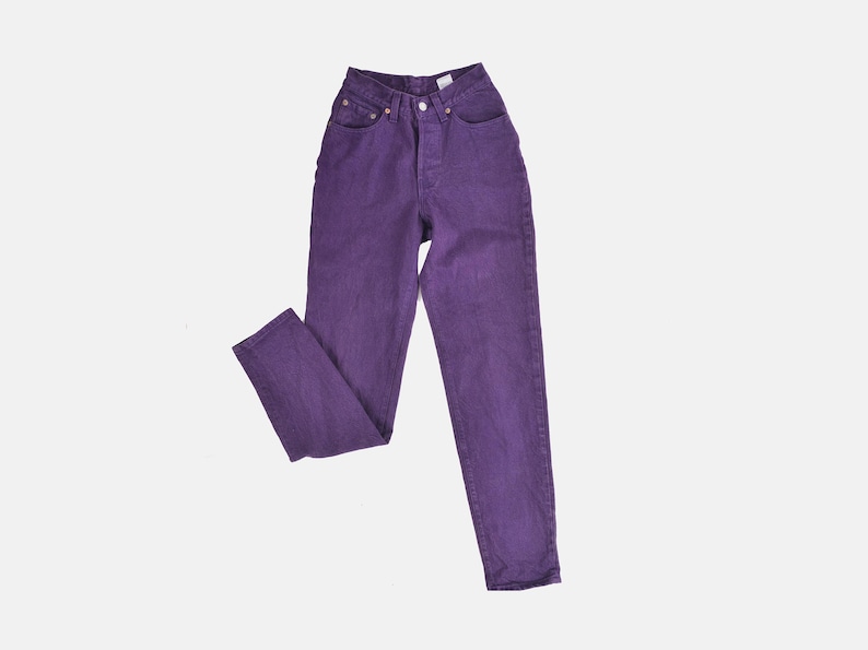 vintage 80s purple Levi's high waisted slim fit tapered leg jeans with button down fly.