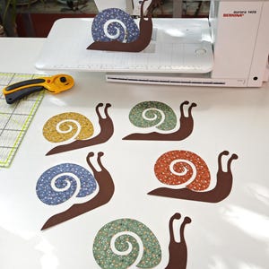 Snails silhouettes laser cut cotton appliqués | baby designs for patchwork