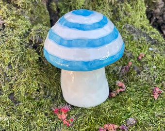 blue and white striped ceramic mushroom