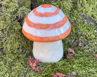 orange and white striped ceramic mushroom