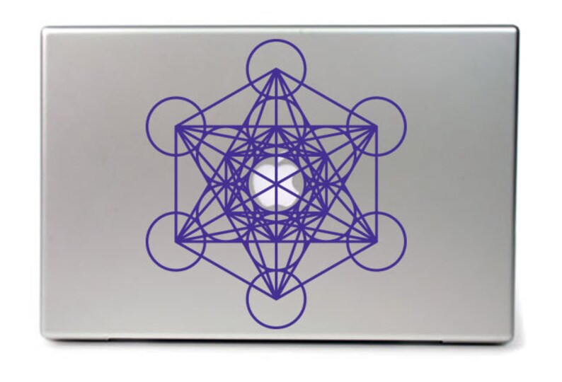 May include: A silver laptop with a purple geometric design sticker on the lid. The design is a complex pattern of overlapping circles and lines, creating a star-like shape.