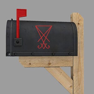 May include: A black mailbox with a red flag and a red pentagram symbol on the front.
