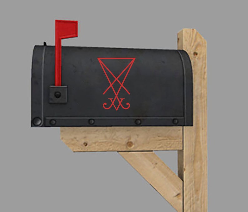 May include: A black mailbox with a red flag and a red pentagram symbol on the front.