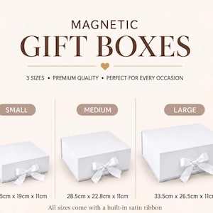 May include: Three white rectangular magnetic gift boxes with satin ribbon bows. Small box: 24.5cm x 19cm x 11cm. Medium box: 28.5cm x 22.8cm x 11cm. Large box: 33.5cm x 26.5cm x 11cm. Text reads: MAGNETIC GIFT BOXES, 3 SIZES, PREMIUM QUALITY.