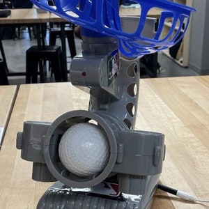 Switch-adapted ball pitcher