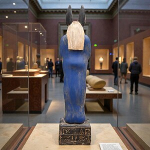 Detailed Anubis statue depicting the jackal-headed Egyptian god standing in a traditional pose, inspired by ancient Egyptian funerary art.