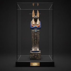 Detailed Anubis statue depicting the jackal-headed Egyptian god standing in a traditional pose, inspired by ancient Egyptian funerary art.
