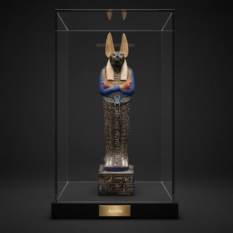 Detailed Anubis statue depicting the jackal-headed Egyptian god standing in a traditional pose, inspired by ancient Egyptian funerary art.