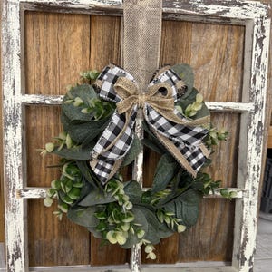 Rustic window frame with wreath