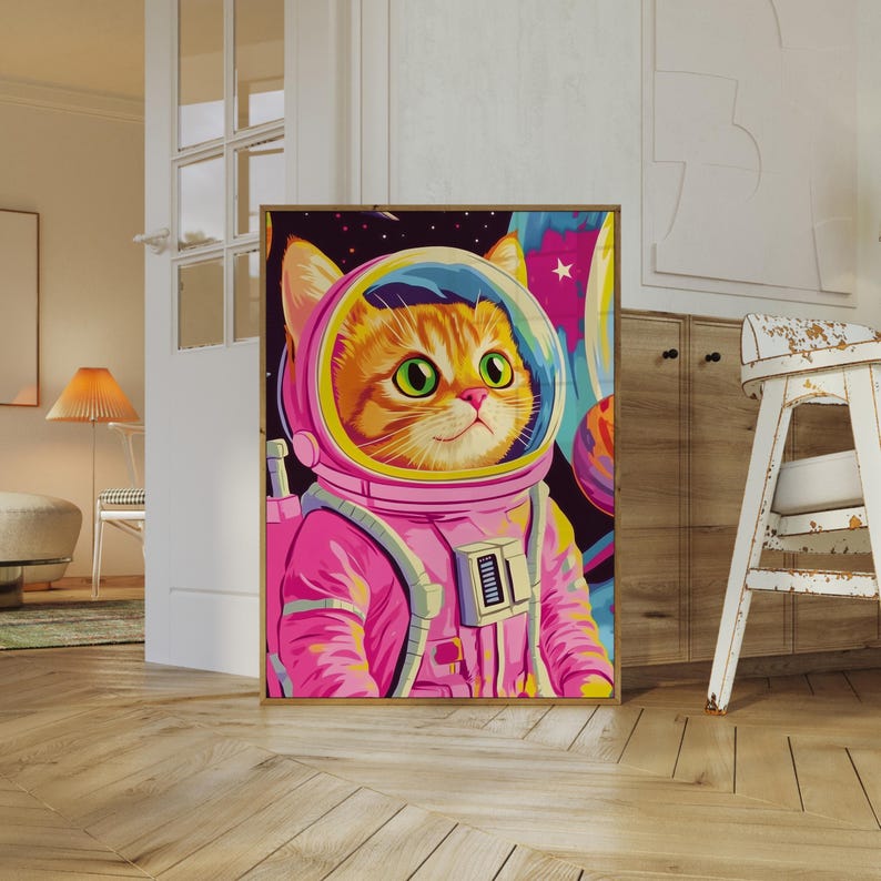 Funny orange cat wearing a pink astronaut suit in a colorful galaxy setting. This digital print combines pink poster aesthetics, dopamine decor energy, and girly prints charm. Ideal for fans of funny cat art, printable wall art, pink cat designs, and colorful wall arts. A playful coquette print perfect for cat lovers, space enthusiasts, and anyone who enjoys vibrant, happy decor.