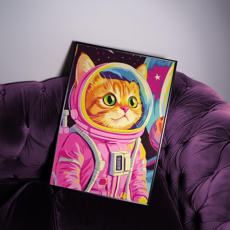 Funny orange cat wearing a pink astronaut suit in a colorful galaxy setting. This digital print combines pink poster aesthetics, dopamine decor energy, and girly prints charm. Ideal for fans of funny cat art, printable wall art, pink cat designs, and colorful wall arts. A playful coquette print perfect for cat lovers, space enthusiasts, and anyone who enjoys vibrant, happy decor.