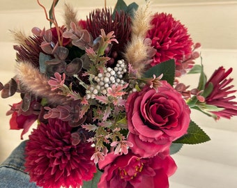 Faux burgundy and red bridal bouquet with dried pampas grass and greenery accents