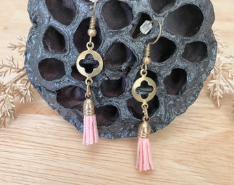 Elegant gold earrings with blush tassel detail