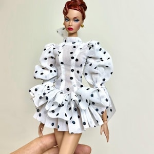 May include: A handmade wooden sign with the text "Welcome to our home" in a handwritten style. The sign is painted white with a dark stained frame. A small, decorative heart is in the bottom right corner.