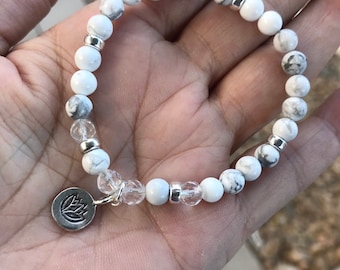 Howlite and Crystal Quartz  beaded Stretch Bracelet with a Lotus Flower Sterling Silver Charm