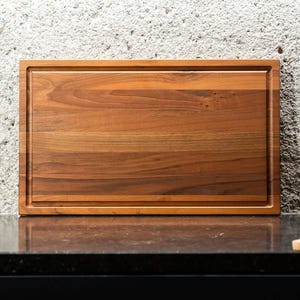 Walnut edge-grain cutting board with juice groove