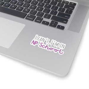 May include: A laptop computer with a sticker that reads "I can't, I'm in NP School". The sticker is white with pink text.