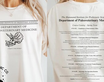 May include: A white t-shirt with a black graphic print of a dinosaur skull and the text "The Hammond Institute of Prehistoric Sciences Department of Paleoveterinary Medicine". The back of the shirt has a course catalog for the Department of Paleoveterinary Medicine.