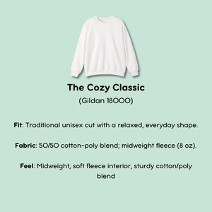 May include: A white crewneck sweatshirt, labeled "The Cozy Classic" by Gildan. The image highlights the sweatshirt's traditional unisex cut, relaxed shape, and midweight fleece fabric, perfect for everyday wear.